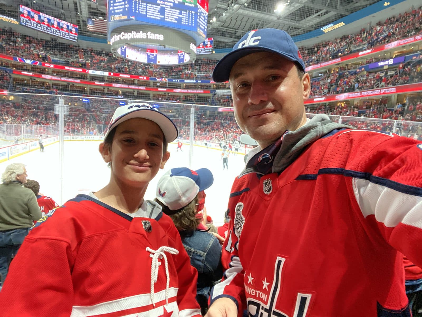 Martin E and Martin A in Capitals jerseys at a Capitals home game